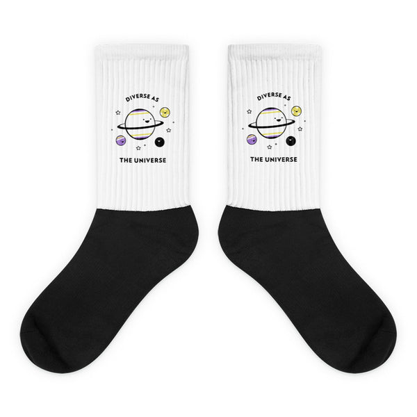 Pair of black-and-white socks with planets and “DIVERSE AS THE UNIVERSE” text