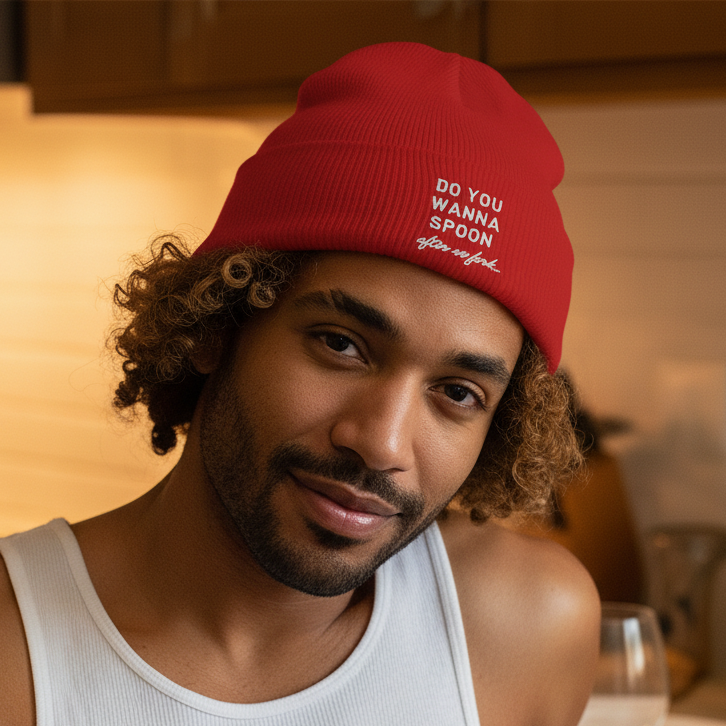 Do You Wanna Spoon After We Fork Cuffed Beanie in black with white embroidery, worn by a person in a white tank top