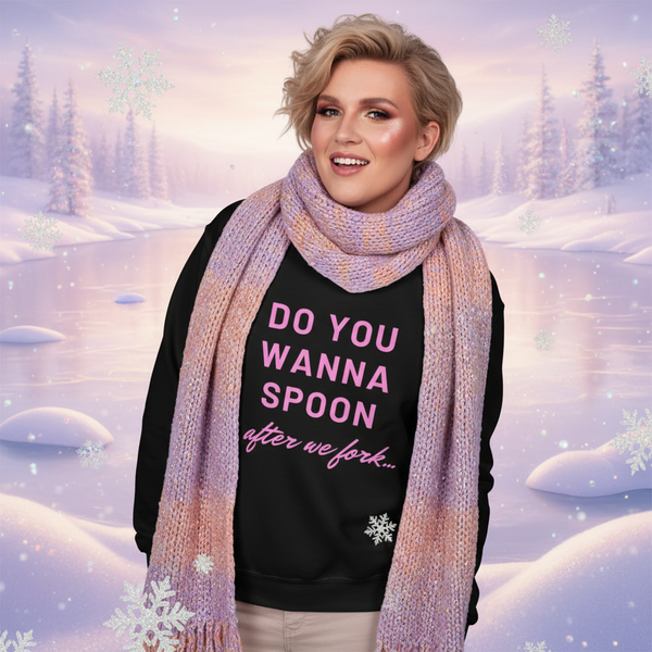 Model wearing a black sweatshirt reading “DO YOU WANNA SPOON after we fork...”