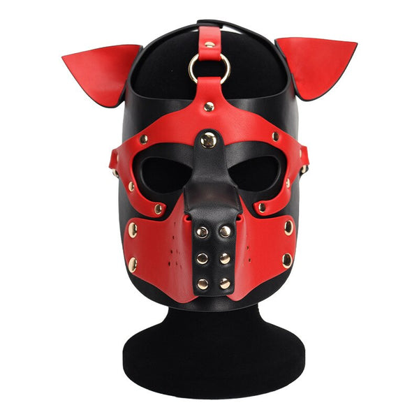 Front view of a red and black leather dog mask with pointed ears and metal studs