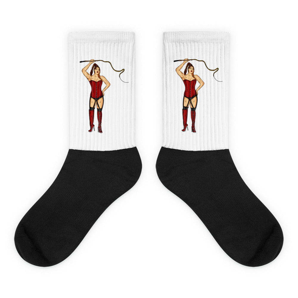 Pair of white-and-black socks with matching red-corseted dominatrix illustrations