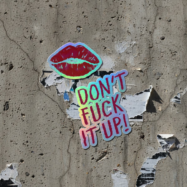 Don't Fuck It Up! holographic sticker with shiny red lips over bold rainbow text