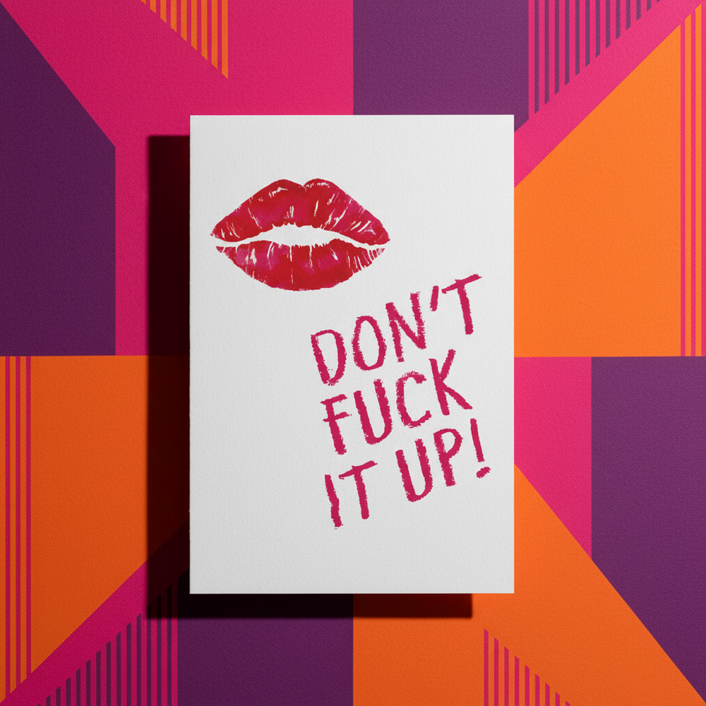Postcard with "Don't Fuck It Up!" in bold pink on a white background, lipstick mark, and queer orange, pink