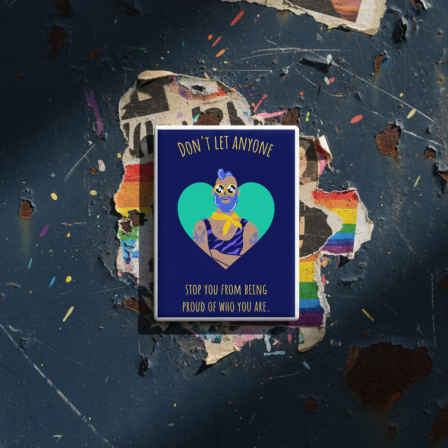 Rectangular magnet reads “Dont Let Anyone Stop You From Being Proud” with a tattooed person, heart, rainbow accents