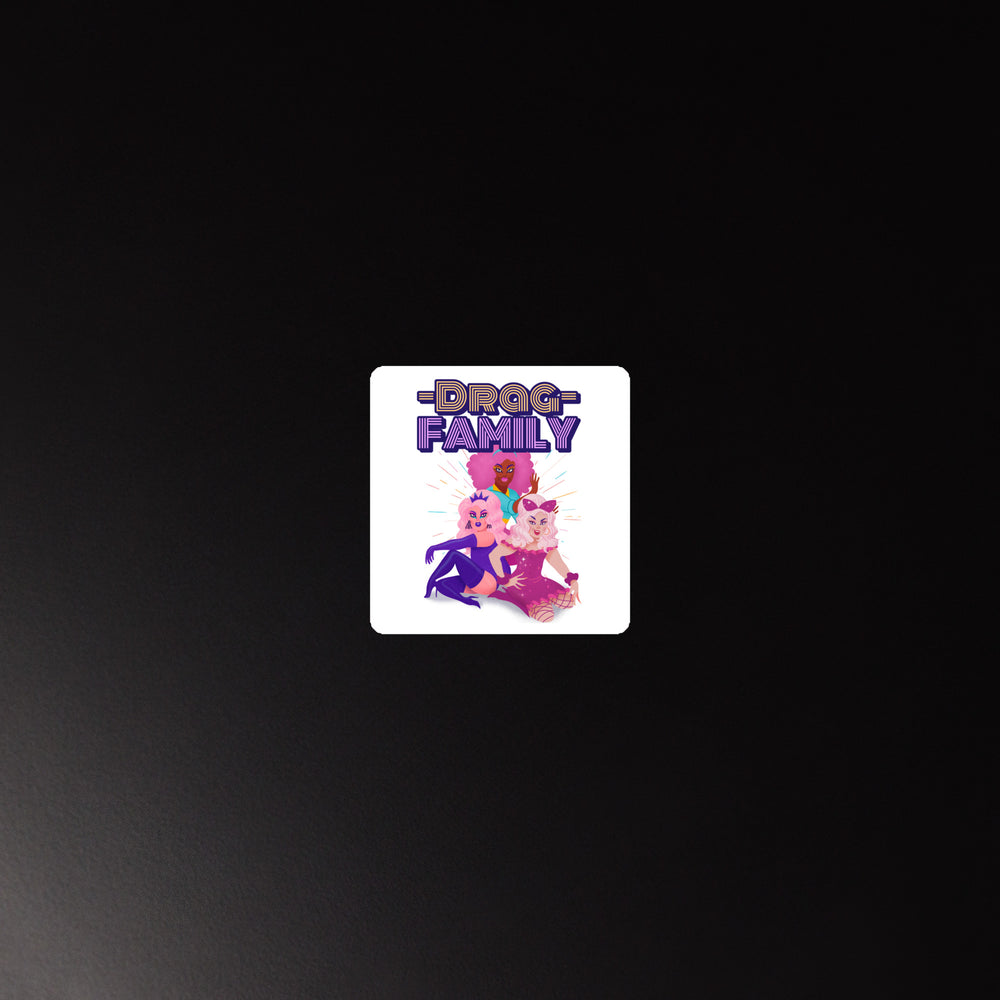 White square magnet with three pink and purple cartoon dogs under bold purple "DOG FAMILY" text