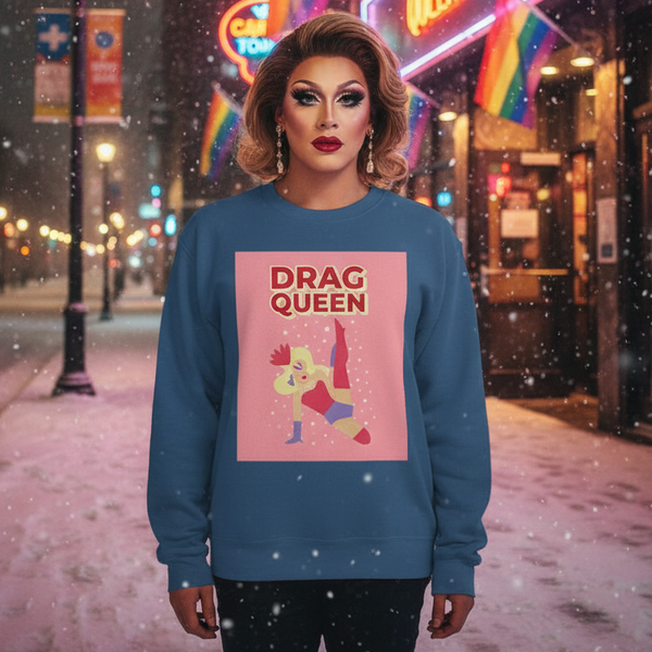 Drag performer wearing a blue sweatshirt with a pink DRAG QUEEN graphic on a snowy street