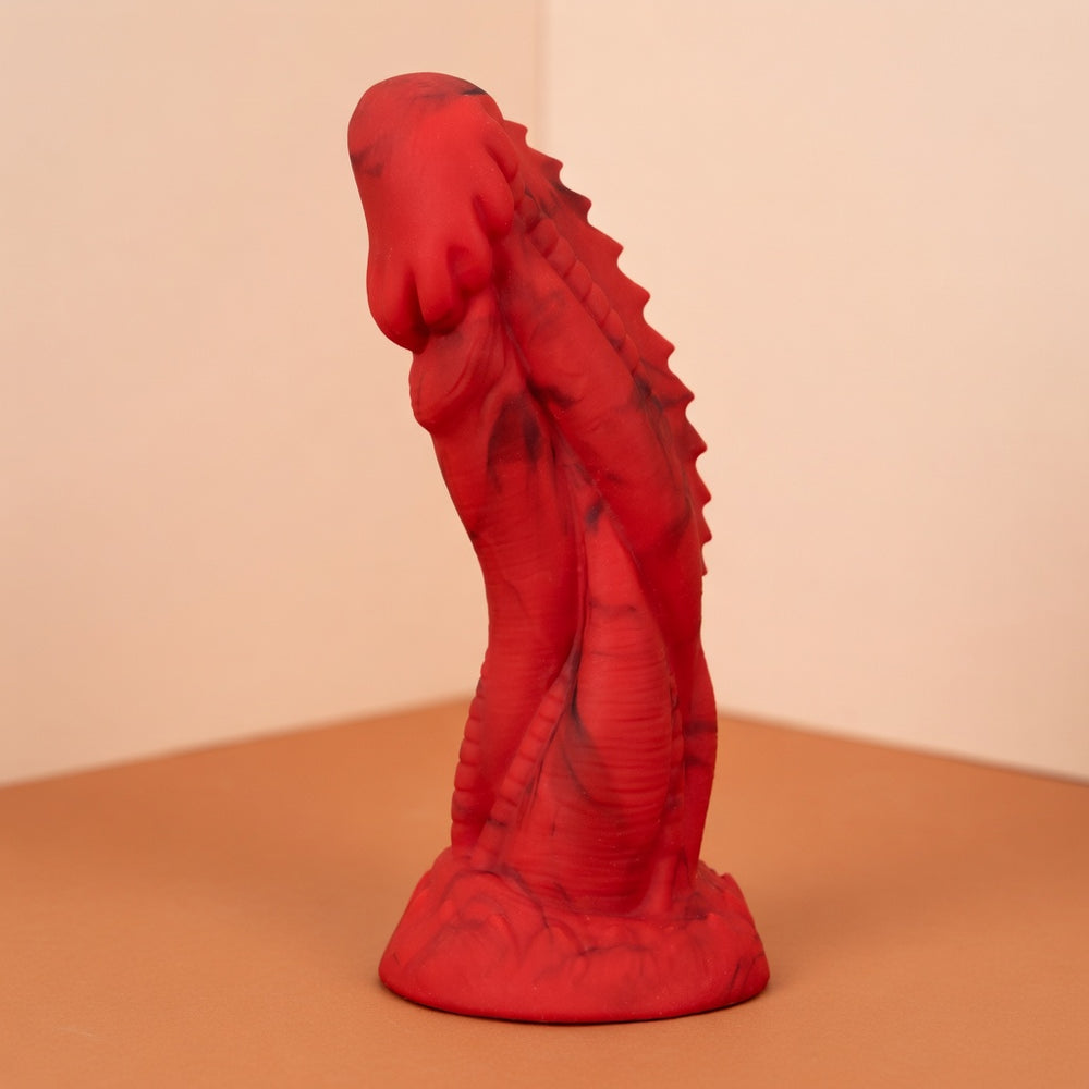 Red Dragon Fantasy toy with sculpted ridges and a flared base in a standalone studio photograph.