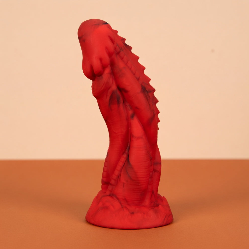 Red Dragon Fantasy toy with sculpted ridges and a flared base in a standalone studio photograph.