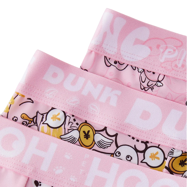 Close-up of pink cartoon-print boxers with wide logo waistband and winged coin motifs