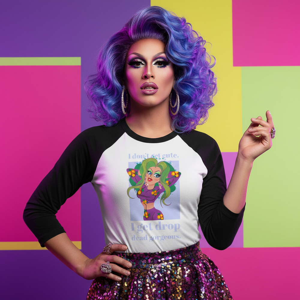 Drop Dead Gorgeous 3/4 sleeve raglan shirt with a cartoon drag queen, worn with hoop earrings, sequined skirt, bold makeup