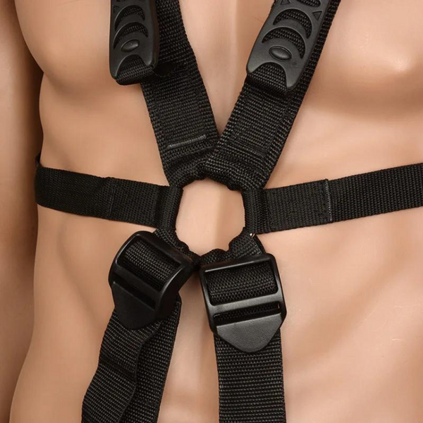 Close-up of a black erotic sex sling harness fitted around a nude mannequin torso