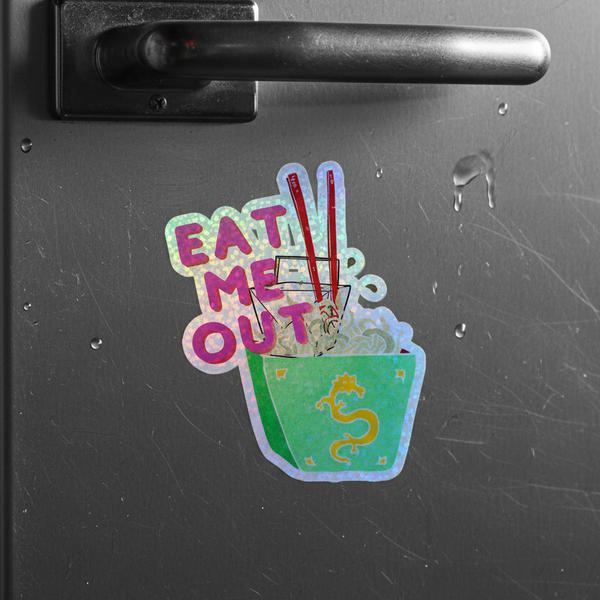 Holographic sticker with “EAT ME OUT” above a green noodle takeout box, red chopsticks, yellow dragon, rainbow vinyl shimmer.