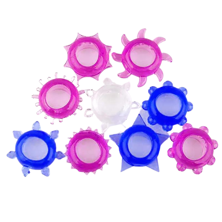 Flat lay of nine translucent blue, pink, and clear spiked silicone cock rings