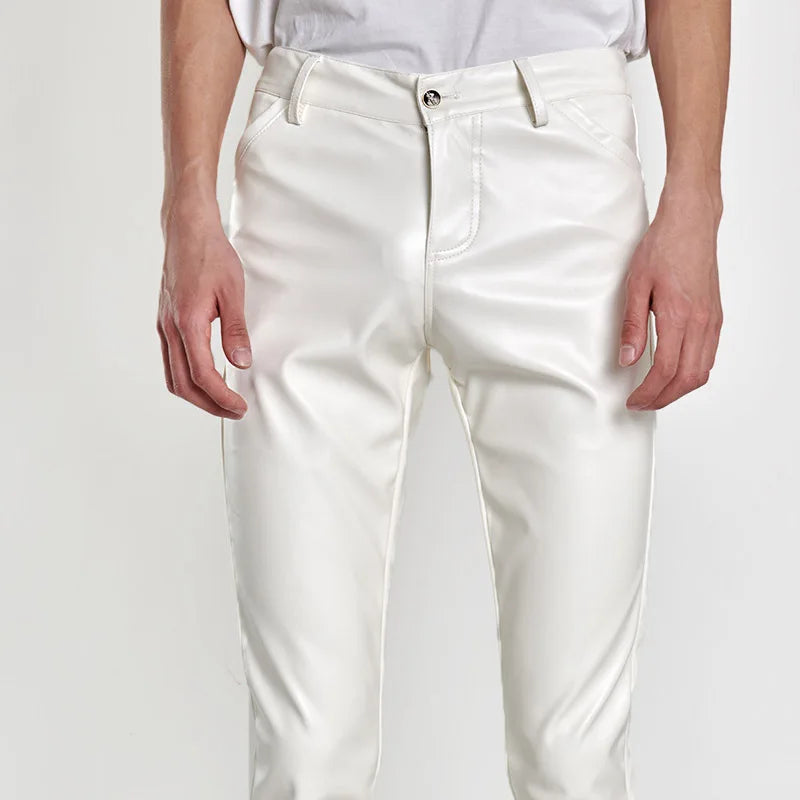Front view of a model wearing slim white faux-leather pants with five-pocket styling