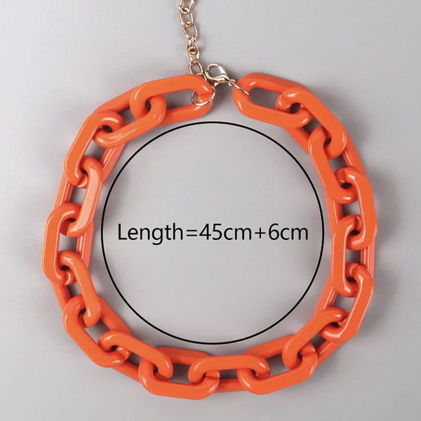 Orange chunky oval-link chain necklace arranged in a circle, with a gold-tone extender chain