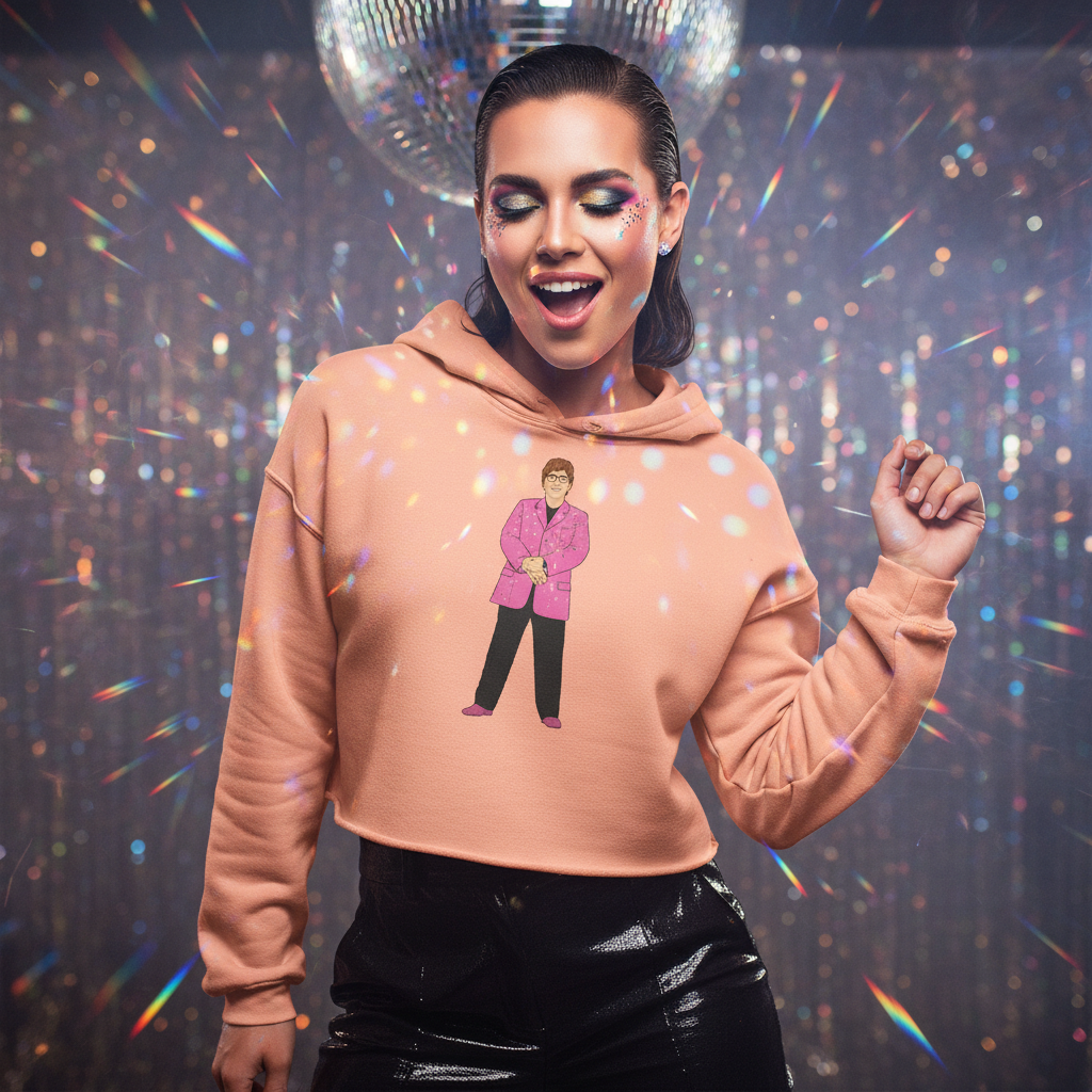 Model wearing a peach cropped hoodie with an illustrated person in a pink blazer