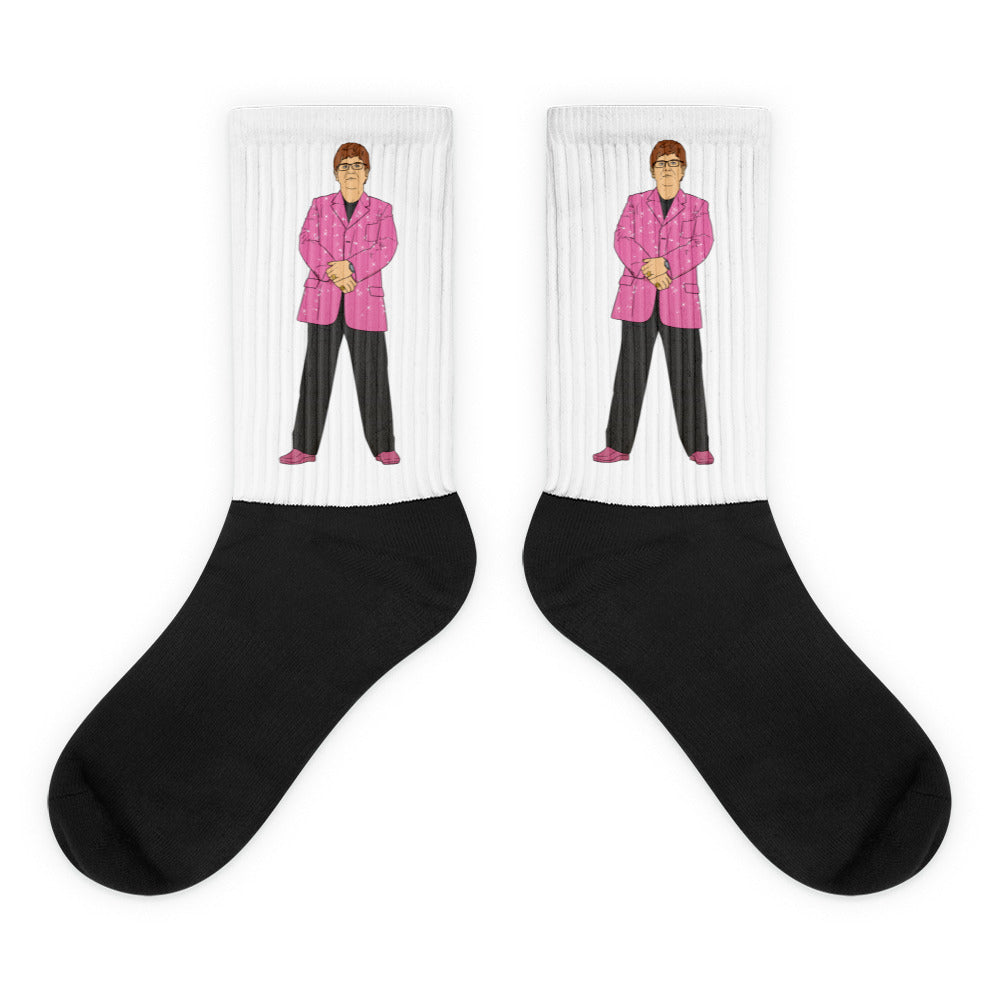 Pair of crew socks with black feet and a cartoon man in a pink suit