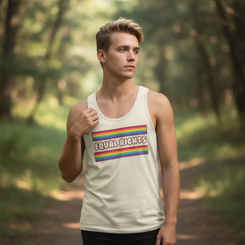 Unisex tank top in cream with rainbow Pride stripes and “Equal Rights” slogan, worn by a blond man on a forest path.
