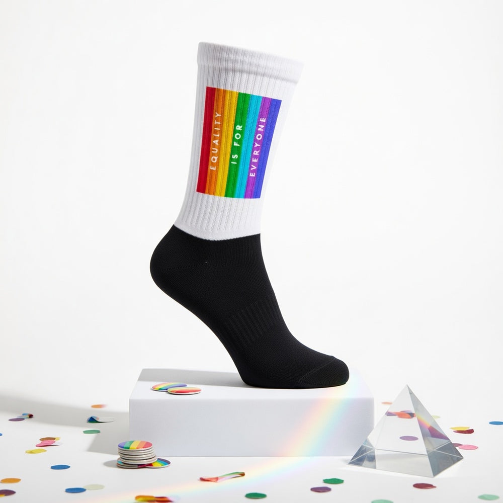 Crew-length socks with a white leg, black foot, rainbow stripes, and "Equality Is For Everyone" text