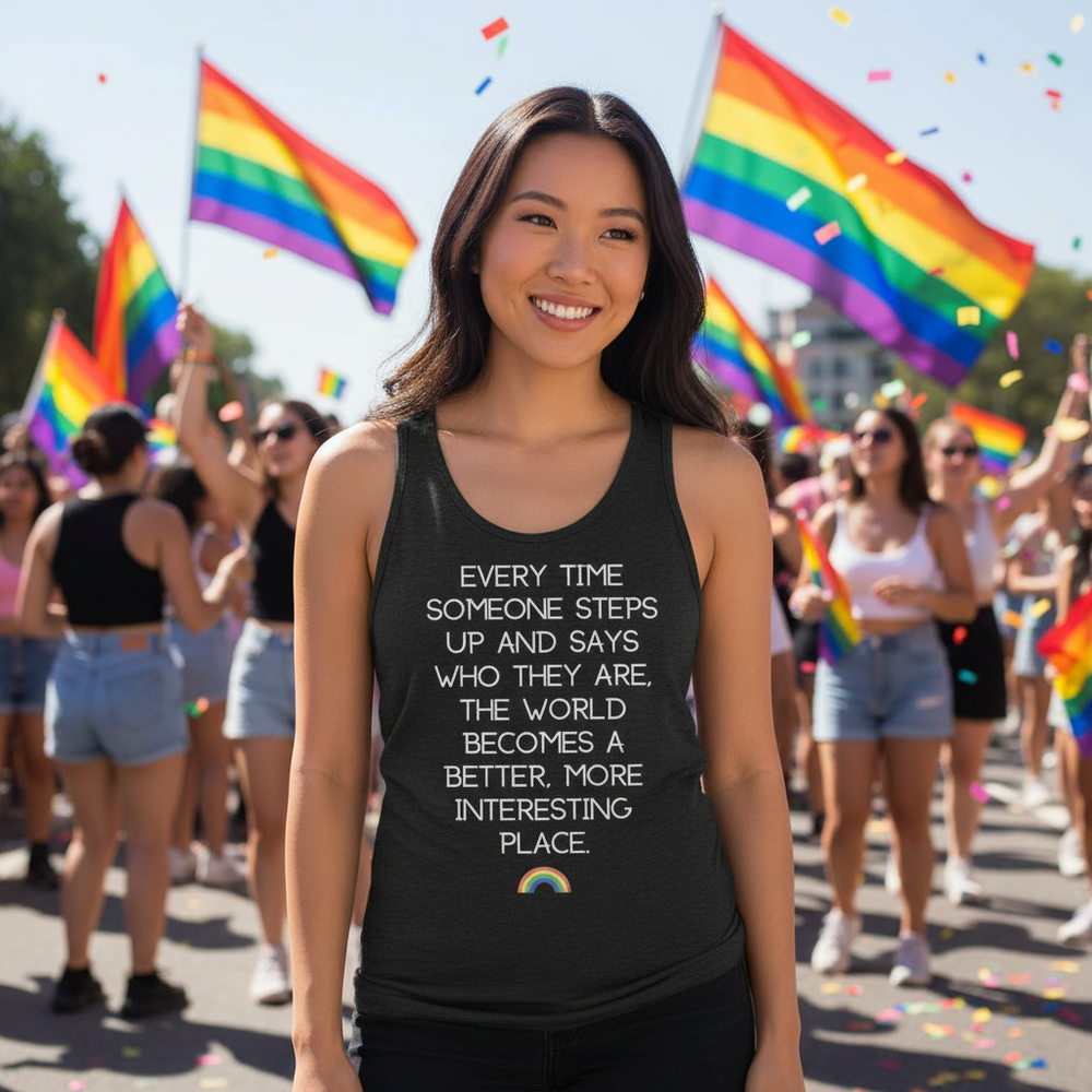 Unisex tank top reading “Every Time Someone Stands Up” worn by a smiling person at Pride