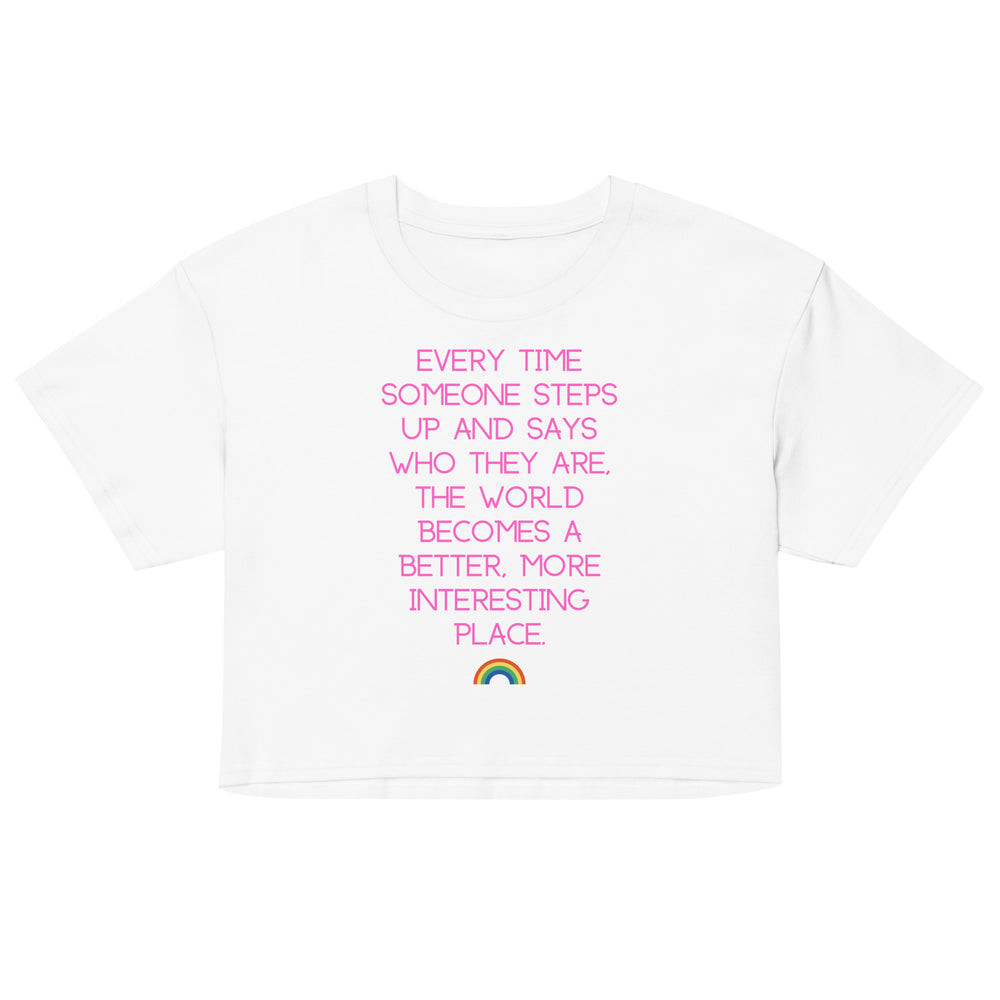 Front view of a white crop top with pink text and a small rainbow graphic