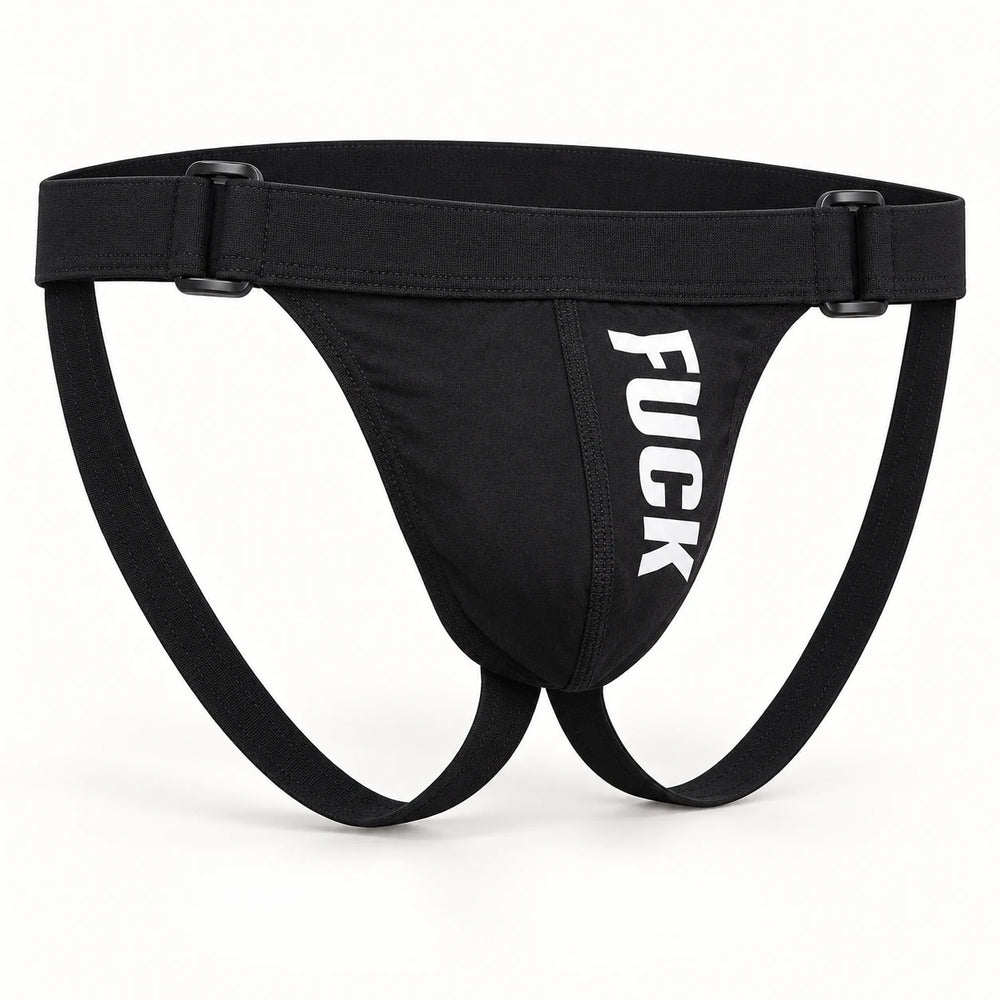 Black F#CK jockstrap displayed upright against ivory, showing its shaped pouch, waistband sliders and rear leg straps.