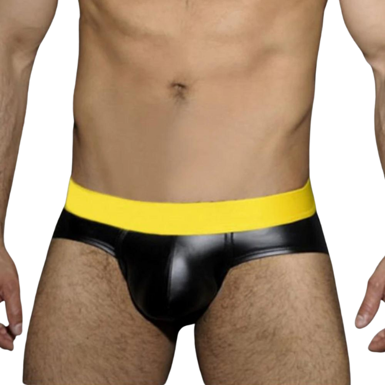 Front view of a model wearing a black faux-leather jockstrap with a bright yellow waistband