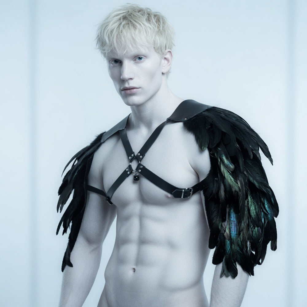 Model wearing a black leather chest harness with large dark feathered shoulder wings