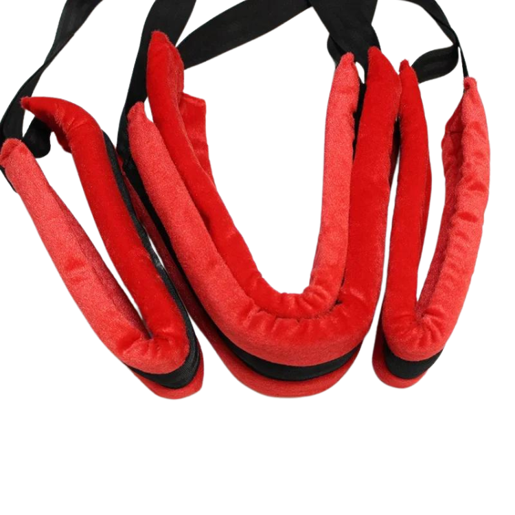 Close-up of a red-and-black padded BDSM sex swing with multiple hanging straps
