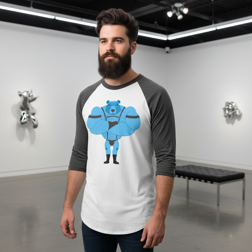 Fetish Gay Bear 3/4 sleeve raglan shirt with a bold cartoon blue bear, worn by a bearded man in an art gallery setting.