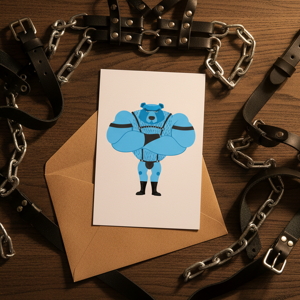 Fetish Gay Bear Postcard with a cartoon blue bear in leather gear on a brown envelope, wood table, leather straps and chains.