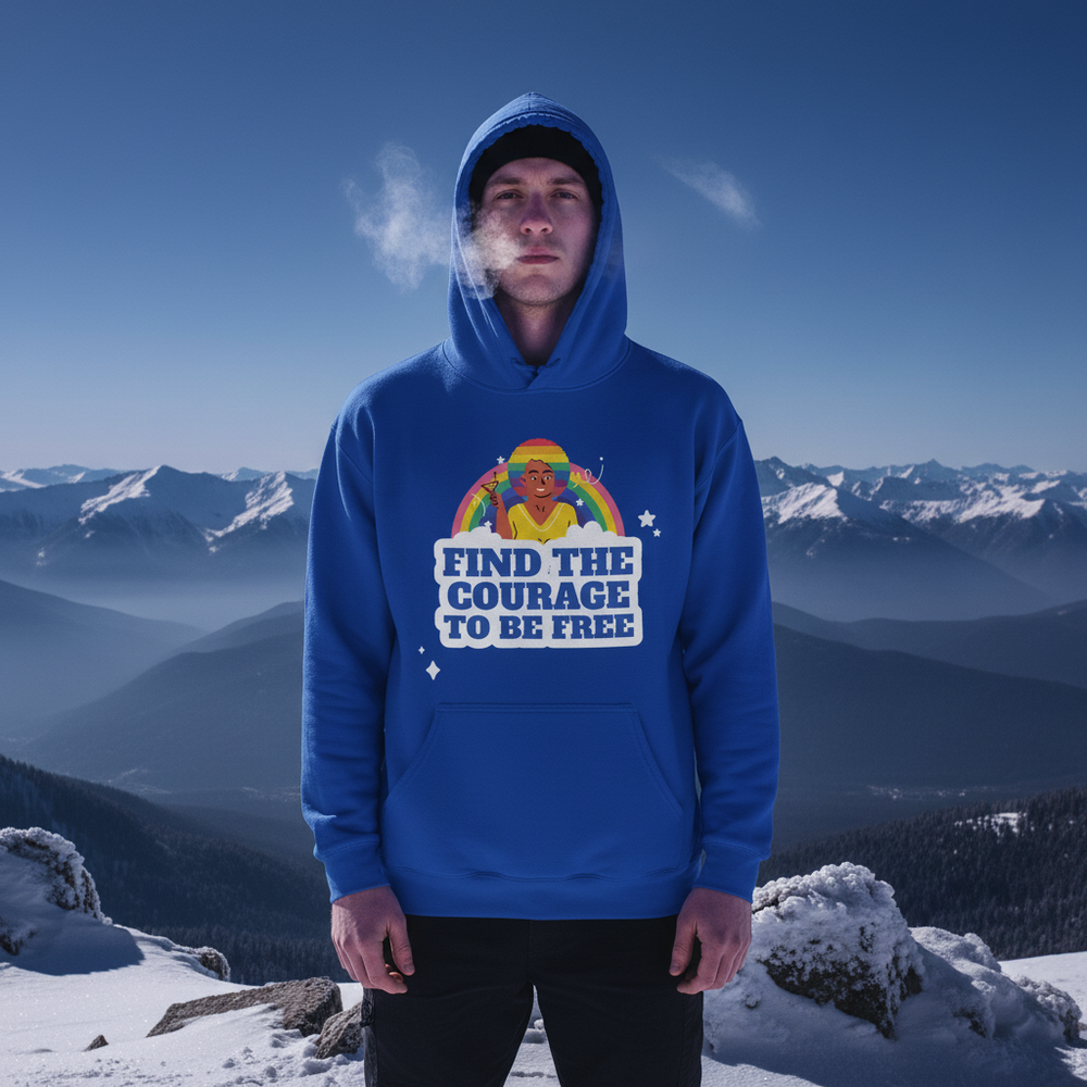 Front-facing person in a blue hoodie reading “FIND THE COURAGE TO BE FREE” on a snowy mountain