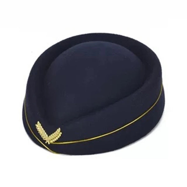 Navy pillbox-style hat with gold piping and a gold wing emblem, shown on white