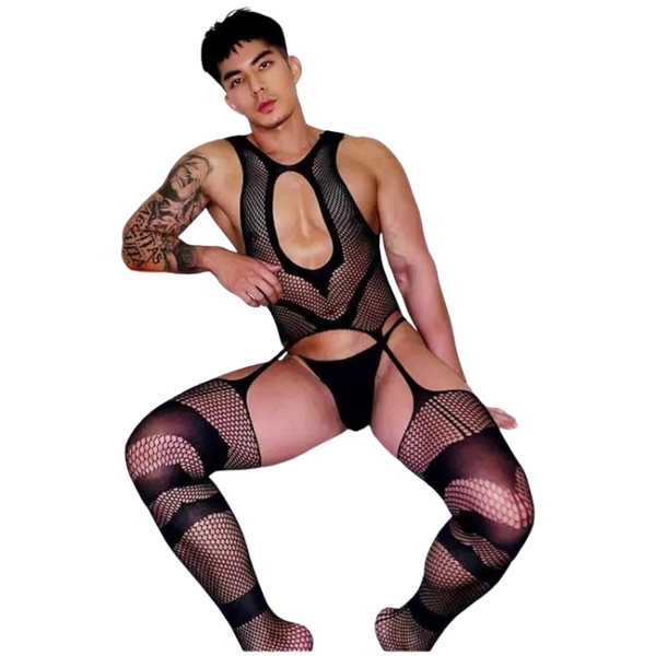 Seated model wearing a black fishnet bodysuit with cutouts and matching thigh-highs
