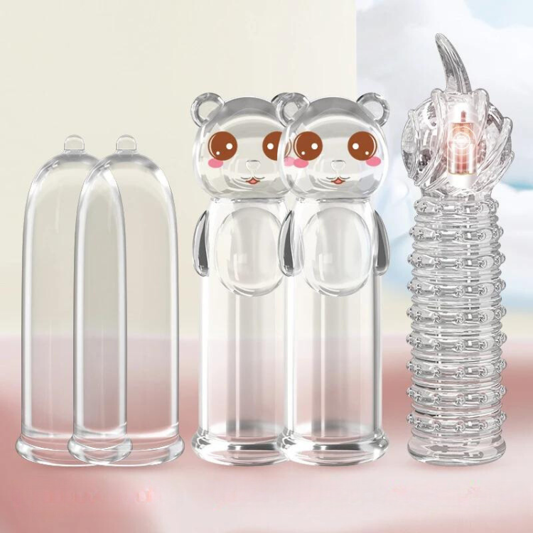 Clear fingertip sleeves and a ridged stimulator with a small internal motor, displayed upright