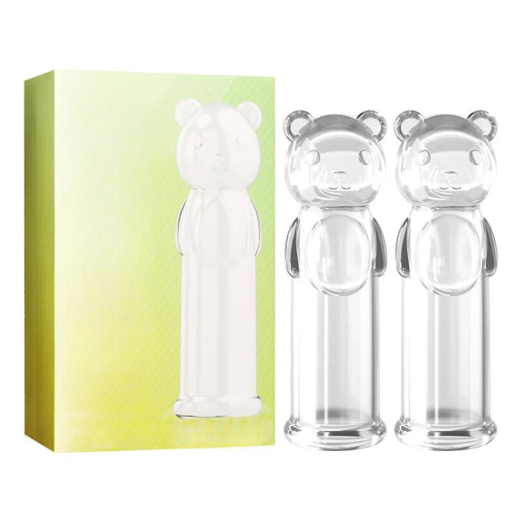 Green product box beside two clear bear-shaped fingertip stimulators