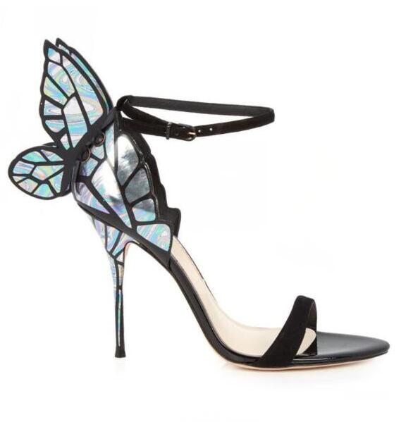 Side view of a black stiletto sandal with iridescent butterfly-wing straps and ankle tie
