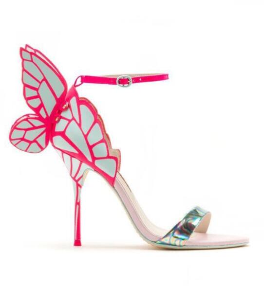 Side view of a pink butterfly-wing stiletto sandal with an ankle strap