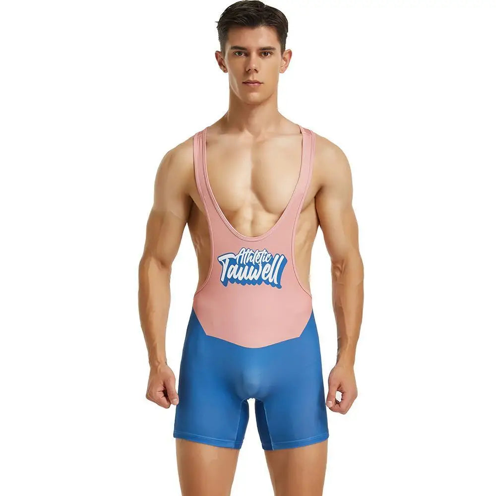 Front-facing model wearing a pink and blue one-piece wrestling-style swimsuit