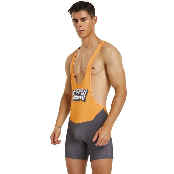 Front three-quarter view of a person wearing an orange and charcoal one-piece wrestling swimsuit