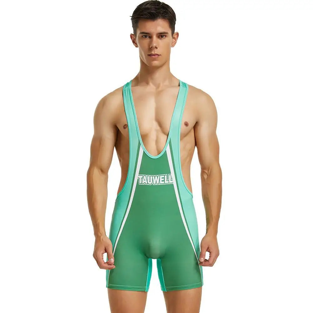 Front view of a model wearing a green one-piece gym swimsuit with white trim, against white