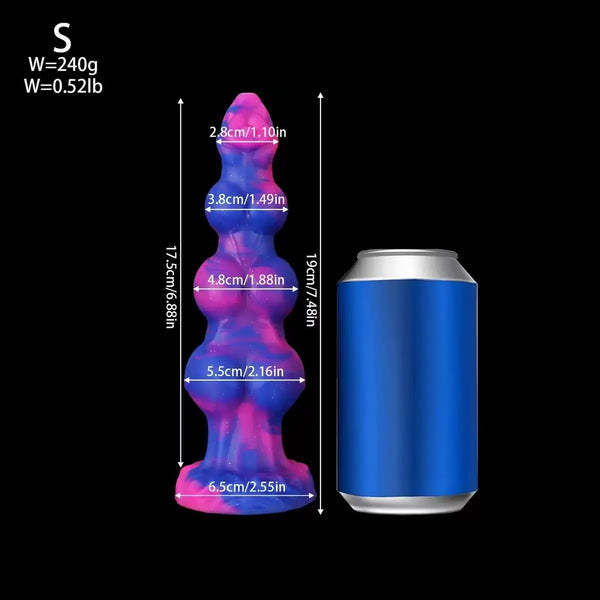 Galaxy-swirl silicone anal plug beside a blue can for size comparison, with measurements shown