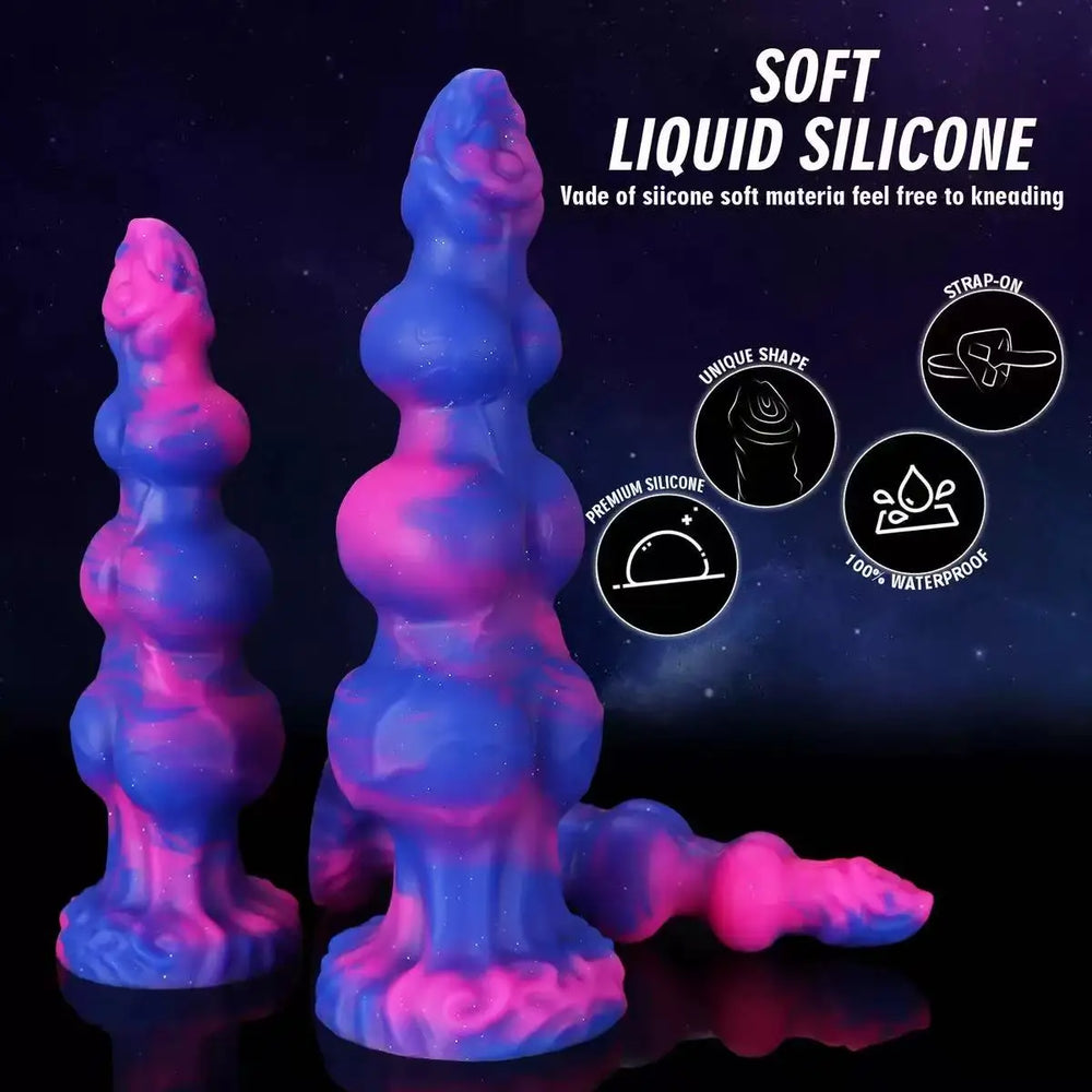 Three galaxy-colored silicone anal plugs shown upright and lying down with wide bases
