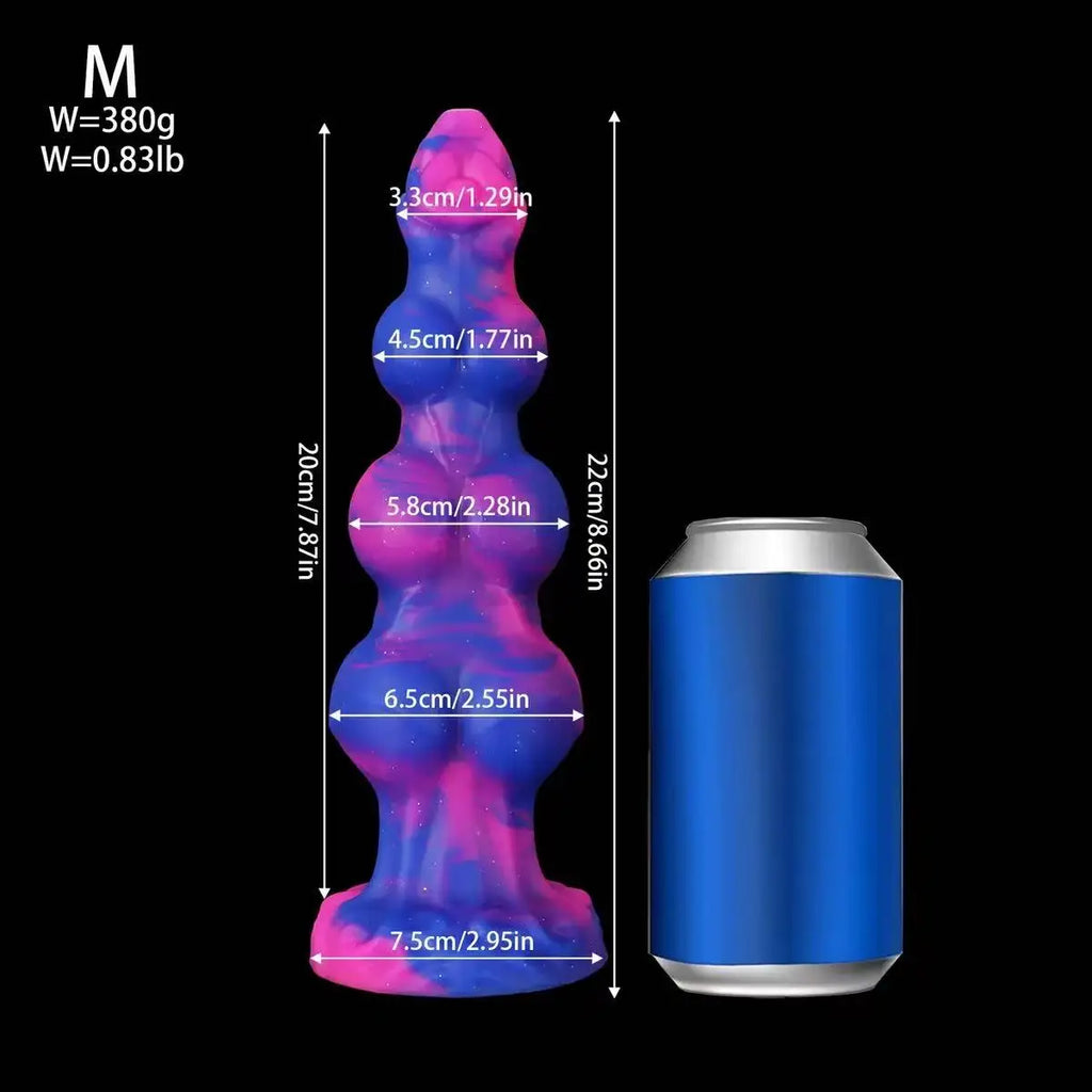 Galaxy-pattern silicone anal plug shown beside a can for scale, with dimension arrows