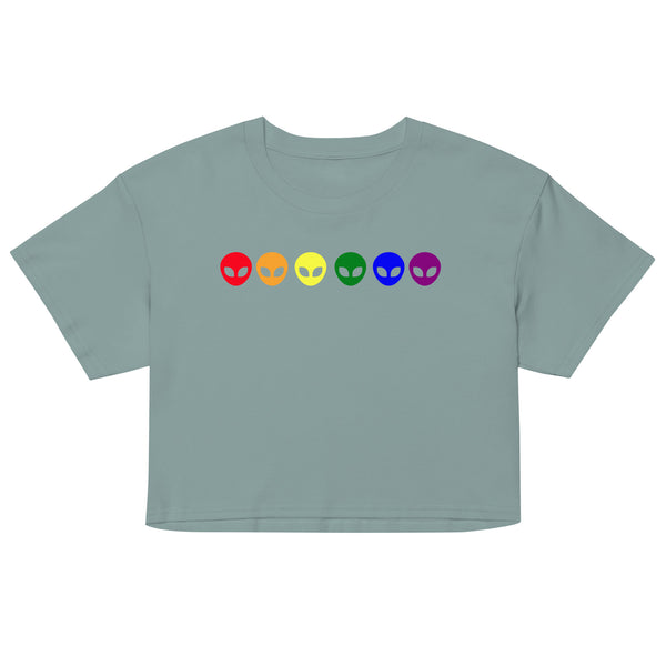 Front-facing sage-green crop top with six colorful alien-head icons across the chest