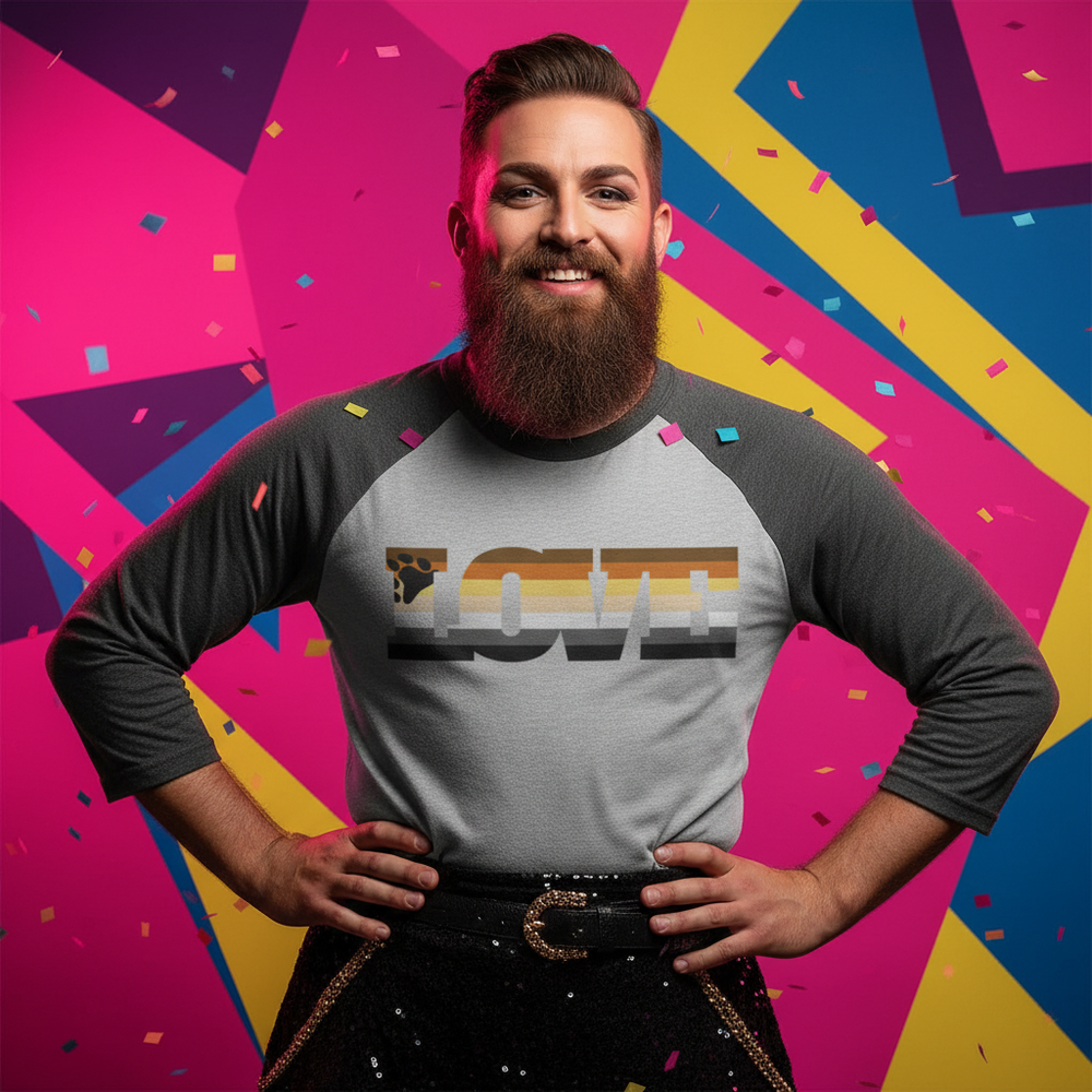 Gay Bear Pride 3/4 sleeve raglan shirt worn by a smiling bearded person; confetti, pink, yellow