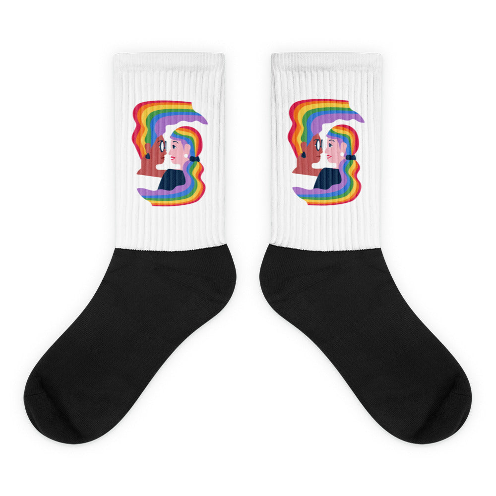 Pair of black-and-white crew socks with a rainbow-haired couple kissing