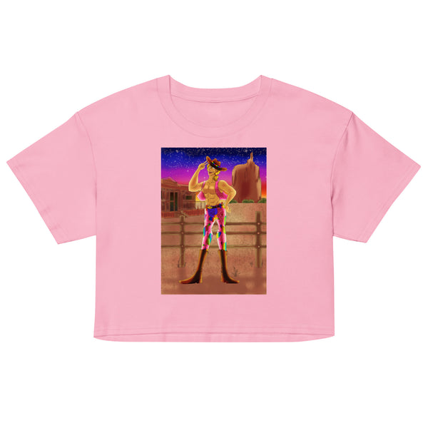 Front view of a pink crop top with a colorful cowboy illustration at sunset