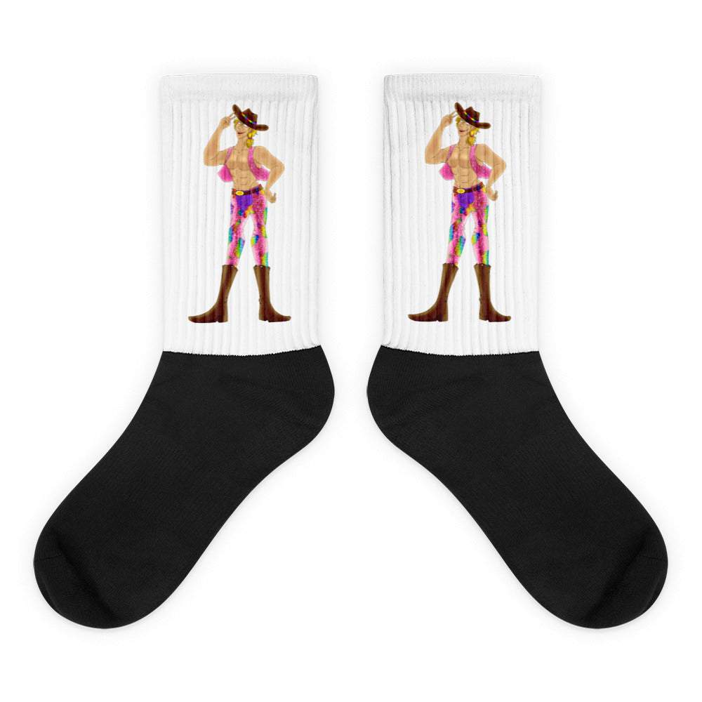 Pair of black-and-white crew socks featuring a colorful shirtless cowboy in a hat and boots