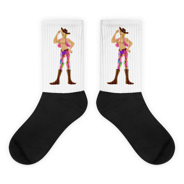 Pair of black-and-white crew socks featuring a colorful shirtless cowboy in a hat and boots